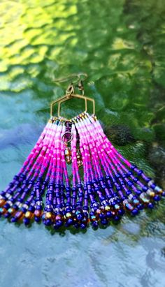 Elevate your style with our handcrafted Beaded Fringe Earrings. These stunning earrings feature intricate beadwork, cascading delicately to create a dynamic fringe effect. Perfect for adding a touch of elegance and movement to any outfit, these earrings are lightweight yet striking, making them ideal for both day and evening wear. The vibrant colors and unique design make them a standout accessory, whether you're dressing up for a special occasion or adding flair to your everyday look. Embrace the artistry and sophistication of beaded jewelry with these must-have statement earrings. Unique Beaded Fringe Earrings, Unique Beaded Fringe Dangle Earrings, Unique Fringe Dangle Beaded Earrings, Multicolor Fringe Party Earrings, Multicolor Beaded Fringe Earrings With Unique Style, Unique Adjustable Beaded Fringe Earrings, Unique Fringed Dangle Beaded Earrings, Rainbow Fringe Dangle Jewelry, Rainbow Fringe Dangle Earrings