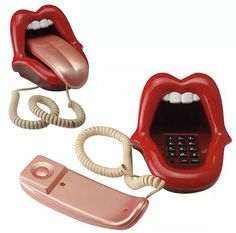 an old style phone with two mouths open and a telephone cord attached to the receiver