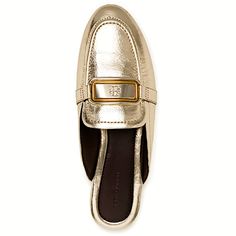 Tory Burch Georgia 10mm Backless Loafers Metallic Leather Upper Gold And Enamel Logo Plate Cushioned Leather Footbed Chrome-Free Napa Leather Lining Buffed Leather And Rubber Sole Dust Bag $298 Gold Slip-on Mules For Work, Gold Slip-on Loafers For Office, Elegant Flat Mules With Metal Feet, Luxury Gold Slip-on Mules, Elegant Gold Mules For Workwear, Elegant Gold Flat Mules, Designer Gold Loafers For Work, Chic Gold Loafers With Metal Feet, Gold Mules For Work