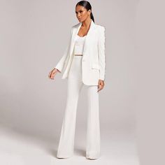 Calista White Rhinestone Arm Blazer & Pant Two Piece Set for Women - Slim Fit Ladies' luxury suit set with rhinestone detailing on the jacket. Sophisticated design featuring a peak lapel and single button closure. Flattering fit with subtly flared ankle-length trousers. Crafted from high-quality materials for durability and style. Ideal for formal occasions or professional settings, showcasing timeless elegance. Size Chart: (in CM) Size Bust Waist Sleeves Length Shoulder XS 88 70 57 72 37 S 92 7 Bodycon Suit, Handmade Pants, Slim Fit Blazer, Designer Suit, Single Button Blazer, Pantsuits For Women, Slim Fit Blazers, Blazer Designs, Bootcut Pants