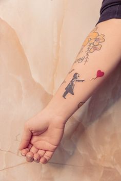 a person with a tattoo on their arm