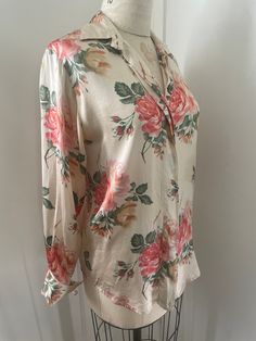 100% Silk oversize cabbage rose pattern blouse from authentic vintage Ann Taylor  Has a discoloration that I haven't tried to remove. May come out at the cleaners but it camouflages easily  into the design so not that big of a deal imo. Detail in pic. Labeled size 4 Measurements taken flat double when necessary  Shoulder to shoulder 16" Pit to pit 21" Sleeve length 24" Shoulder to hem 27" Due to the nature of vintage, all items in my store are sold as is. All sales are final without exception, I have a no returns/refunds policy. However, please contact me if there is a problem with your order. Please refer to the FAQs at the bottom of the page of my main store for my shop policies. By purchasing from my shop you are agreeing to my shop policies. Luxury Vintage Printed Blouse, Classic Long Sleeve Blouse With Floral Print, Classic Long Sleeve Floral Print Blouse, Long Sleeve Floral Print Shirt For Daywear, Spring Floral Print Blouse With Spread Collar, Casual Spring Blouse With Vintage Print, Vintage Print Long Sleeve Summer Blouse, Vintage Print Long Sleeve Blouse For Summer, Classic Floral Print Fall Blouse