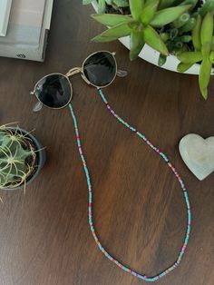 [NEW IN] Boho Chic Sunglasses Beads Chain in more than 10 styles! Show off your unique style with these practical and colorful Sunglasses cord.   ◆ Adjustable Rubber Holders to keep cord in place and glasses secure! ◆ Flat, 26" Length ◆ Colorful beads ◆ Easy attachment, fits ALL glasses! ◆ Perfect for Sunglasses or Reading Glasses ◆ Comfortable and cool!  ◆ Inti is Proudly Canadian! Perfect for everyday wear, yoga, working-out, reading, hiking, rock climbing or just enjoying life while looking g Trendy Glasses Chains With Colorful Round Beads, Trendy Glasses Chains With Round Beads, Trendy Everyday Beaded Glasses Chains, Everyday Glass Jewelry For Summer, Trendy Round Beads Glasses Chains For Beach, Trendy Glass Jewelry For Festivals, Trendy Glass Festival Jewelry, Trendy Summer Glass Jewelry, Summer Beaded Necklaces With Adjustable Chain