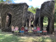 several chairs are arranged in front of an animal - like structure