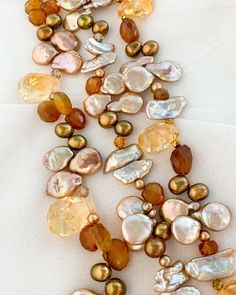 Victoria multistrand statement necklace is a showstopping piece with semiprecious stones including Grade A Citrine, Hessonite, Chalcedony, and colored Pearls. Gold filled beads and gold filled clasp top this one of a kind necklace off! Necklace has three strands and is adjustable from 17.5 inches up to 21 inches. ~An enchantingly unique design from Jewelry by Chyrise Elegant Orange Necklaces With Natural Stones, Elegant Beaded Citrine Jewelry, Luxury Multi-strand Gemstone Beads Necklace, Elegant Citrine Gemstone Bead Necklaces, Elegant Citrine Gemstone Beads Necklace, Elegant Gold Beaded Necklace With Gemstone Accents, Elegant Beaded Citrine Necklaces, Elegant Citrine Necklaces With Natural Stones, Elegant Citrine Beaded Necklaces