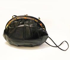 Judith Leiber Karung Black Shoulder Bag with Gems and Goldware, tiop clutch closure, gold metalware, coloured gems, leather strap, inside pocket Condition: vintage, 1990s, very good, slight sign of wear Clutch Evening Bag With Metal Hardware, Evening Clutch With Metal Hardware, Formal Clutch Evening Bag With Metal Hardware, Evening Clutch Bag With Snap Closure, Formal Pouch Bag With Snap Closure, Chic Evening Clutch With Snap Closure, Elegant Party Shoulder Bag With Snap Closure, Black Evening Clutch With Snap Closure, Elegant Pouch Bag With Snap Closure