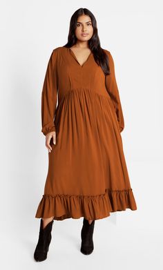 There's nothing quite like the way our Alena Maxi Dress flatter your curves. Designed with a ruffle hem, full length sleeves and made with lightweight fabrication, this dress is just what you need for a look that will turn heads. Key Features Include: - V-neck notched neckline - Full length sleeves with elastic cuffs - Waist definition - Ruffle hemline - Lightweight fabrication - Maxi length Partner with a gold-chain cross-body bag. | Plus Size Dress Alena Midi in Masala, Size 26/3XL | City Chic Fall Dress Plus Size, Plus Size High Fashion, Plus Size Capsule Wardrobe, Plus Size Wedding Guest Dresses, Plus Zise, Plus Size Maxi Dress, Midi Dress Plus Size, Notched Neckline, Plus Size Clothes