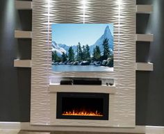 a television mounted on the wall above a fire place in a room with grey walls