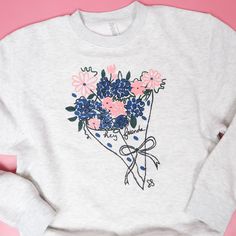 We are sooo ready for the spring time so we are rolling out out the flowers early this year! This bouquet design is professionally screen printed on our signature Lane Seven crewneck. These run true to size, Shaef is wearing the small. We also offer this design in a tee version as well! Have questions about sizing? Email us! heyfriendscompany@gmail.com Care: This crew is machine washable. It is made with 80% cotton and 20% polyester Measurements:small: underarm to underarm - 20 inches Middle of Spring Cotton Sweatshirt With Custom Print, Spring Hand Printed Crew Neck Tops, Bouquet Design, The Flowers, Sweatshirt Designs, Spring Time, Screen Printing, This Year, Sweatshirts Hoodie