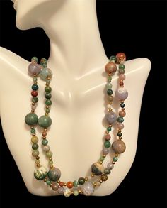 Beautiful multiple colors agate stone necklace. The necklace has agate stones of green, lavender, white, brown and rust. It hangs over the neck without a clasp. It's 35' long.  It's in a great vintage condition. Multicolor Jasper Spiritual Necklace, Spiritual Multicolor Jasper Necklaces, Vintage Agate Necklace With Natural Stones, Vintage Agate Necklaces With Colorful Beads, Vintage Agate Necklace With Colorful Beads, Adjustable Multicolor Jasper Necklaces, Vintage Multicolor Agate Jewelry, Vintage Multicolor Necklaces With Natural Stones, Vintage Multicolor Natural Stones Necklace