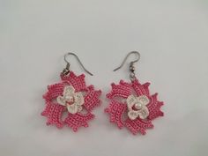 pink and white crocheted flower earrings with silver hooks