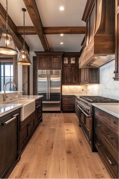 a large kitchen with wooden cabinets and white counter tops, along with an island in the middle