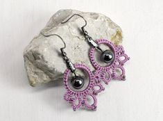 Victorian inspired lace earrings in a gorgeous lavender purple. Matte glass seed beads accent the outer ring. These This design features a metal ring center with tatted lace adorning it. Matte Mauve delica beads accent the outer rings. A dark gray pearl drop accents the center. The cotton Elegant Handmade Lavender Beaded Earrings, Handmade Lavender Beaded Earrings For Gift, Light Purple Earrings, Lavender Jewelry, Tatting Needle, Tatted Jewelry, Lavender Jewellery, Birthday Gift For Best Friend, Lavender Earrings