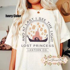 a woman with blonde hair wearing a white t - shirt that says, and last i see the light lost princess