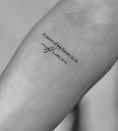 a woman's arm with a quote on it