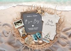 there is a baby announcement on the beach with shoes and other things to put in it