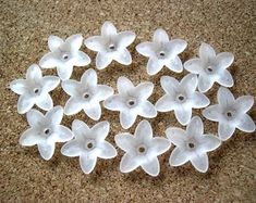 small white flowers are arranged on the floor