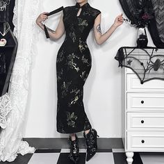 Indulge in elegance with our Alternative Style Cheongsam Midi Dress. Featuring a keyhole neckline and standing collar, this dress exudes sophistication, while the slit hem back and midi length create a feminine and alluring silhouette. The black color, adorned with a gothic-inspired floral and bird pattern, adds a unique and luxurious touch. With a sleeveless design, this dress offers a sleek and modern look, perfect for those embracing alternative aesthetics. Keyhole neckline with standing collar Slit hem back for an alluring silhouette Gothic floral and bird pattern Midi length for a feminine touch Sleeveless design for a sleek, modern look Gothic Floral, Qipao Dress, Alternative Style, Bird Pattern, Standing Collar, Cheongsam Dress, Keyhole Neckline, Lace Dress Long, Midi Dress Summer