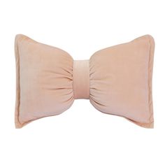 a pink pillow with a large bow on the front and back of it's head