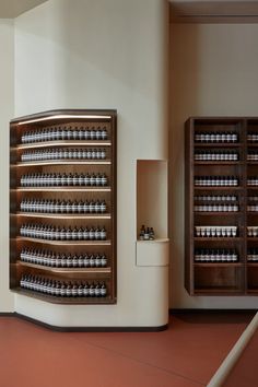 the shelves are filled with many different types of bottles and containers on display in this room