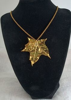 Vintage 1970s goldmaple leaf pendant presented on an goldtone chain. The boho vintage gold leaf pendant measures approximately 2. 5" x 2.75". It is on a sturdy, 20" vintage goldtone chain. This lovely necklace is in excellent condition and is ready to gift and enjoy! Vintage Gold Leaf Jewelry, Vintage Gold Leaf-shaped Jewelry, Gold Leaf Pendant, Lovely Necklace, Gold Dipped, Wear To Work, Boho Vintage, Leaf Pendant, Nature Jewelry