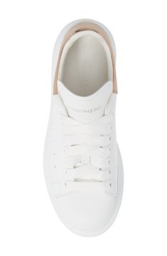 A tall rubber platform lofts a lace-up sneaker from Alexander McQueen, with a removable, padded insole that provides signature comfort. A vibrant-hued panel offers street style to the laid-back silhouette. Style Name:Alexander Mcqueen Sneaker (Women). Style Number: 841497. Alexander Mcqueen Oversized Sneaker, Women Style, Up Styles, White Sneaker, White Lace, Designer Shoes, Alexander Mcqueen, Womens Sneakers, Adidas Sneakers