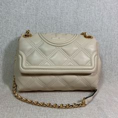 Brand New Never Been Carried New Cream Small Soft Fleming Convertible Shoulder Bag Made Of Cream Quilted Soft Genuine Leather. Dimensions: 9" Wide X 6" Tall Center X 3.5" Deep. Doubled Chain Straps 12" Drop. Push Lock Closure Interior: 1 Zipper Pocket And 1 Slip Pocket 2 Open And 1 Zipper Compartment Fabric Lining. Gold Tone Metalware. Tag Was Removed To Prevent Store Returns. Item Is In Brand New Condition Guaranteed. Designer Quilted Beige Shoulder Bag, Timeless Quilted Rectangular Bag, Luxury Quilted Beige Bag, Beige Quilted Evening Bag, Beige Quilted Evening Shoulder Bag, Luxury Quilted Cream Shoulder Bag, Elegant Beige Quilted Bag, Elegant Quilted Beige Bag, Gucci Ophidia Bag