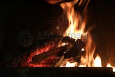 a fire burning in a fireplace with bright flames