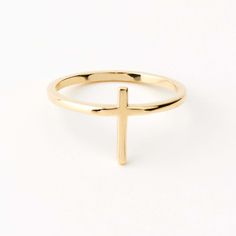 Add a touch of faith and elegance to your everyday look with our dainty Cross Stacking Ring in 14K Gold. Perfect for Christian women, this stacking ring doubles as a protection ring, subtly showcasing your devotion. Crafted as 14k gold jewelry, it makes a thoughtful gift for her. Its delicate design and high-quality material enhance its charm, making it a must-have piece in your jewelry collection. This ring is not just an accessory; it's a statement of faith and fashion. 14k solid gold handcraf Gold Stackable Rings, Protection Ring, Fashion Stand, Thoughtful Gifts For Her, Charm Making, Cross Ring, Delicate Design, 14k Gold Ring, Recycled Gold