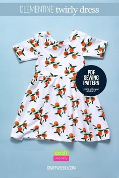 a white dress with oranges on it and the words clementine twirly dress