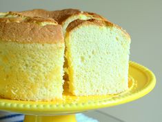 a cake that is cut in half on a yellow plate