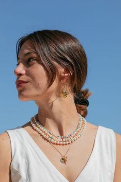 This modern, bright, and candy hued opal and pearl necklace will be your new favorite go-to. The freshwater pearls are dotted with a rainbow of opal gemstones creating new twist on a staple necklace. Each of these pearl and opal necklace are one of a kind making them extra special.  ✦ Choose from two Pearl sizes: Small or Medium ✦ ✦ Kyani is wearing both pearl sizes; Bryson is wearing size Medium ✦ ✦ DETAILS ✦ ✧ You will receive one bracelet. ✧ Name: Makalani (mah KAH lah nee) - eye of heaven. ✧ Multicolor Pearl Drop Necklaces With Round Beads, Multicolor Round Beads Necklace With Pearl Drop, Dainty Pearl Jewelry With Colorful Beads, Multicolor Pearl Drop Beaded Necklace, Multicolor Single Strand Pearl Jewelry, Staple Necklace, Bracelet Name, White Pearl Jewelry, Ethiopian Opal Necklace