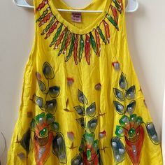 Beautiful Bright Yellow With Multicolored Design Sun Dress . Can Be Use With Leggings. Full Flare Perfect For Summer. Free Size Seller. See My Other Listing Yellow Bohemian Tops For Festivals, Yellow Summer Sundress For Festival, Yellow Cotton Sundress For Vacation, Vibrant Yellow Beach Dress, Yellow Bohemian Cotton Dress, Vibrant Yellow Summer Dress, Mustard Sleeveless Sundress For Summer, Yellow Sleeveless Top For Festivals, Yellow Free Size Casual Dress