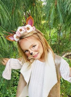 This Kid's (but really it can be for an adult too) Deer Antler Headband is adorable! The headband itself is a hard plastic headband wrapped in soft brown yarn, the antlers are made of a rubber material and look slightly worn. An array of white and pink paper flowers and light green leaves form a crown. There are 2 versions of this, one in a caramel color, and one in a brown! The ears are made out of caramel/brown felt and pink glitter. This is an adorable headpiece for a deer costume! This will Cute Headband For Costume Party, Cute Costume Party Headband, Deer Antler Headband, Headband With Flowers, Pink Paper Flowers, Deer Headband, Deer Antlers Headband, Deer Costume, Brown Yarn