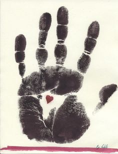 a hand print with a red heart on it