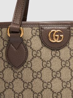 Height: 25cm Width: 31cm Depth: 13cm. Strap drop: 28.5cm. Top handle drop: 12cm. Double fixed straps. Double top handles. Logo details. All over pattern placement may vary. Gold-colored metal hardware. Leather trim. Cotton & linen lining Gucci Top, Gucci Mini, Gucci Ophidia, Small Tote Bag, Mini Tote Bag, Small Tote, Mini Tote, Metal Hardware, Canvas Tote Bag