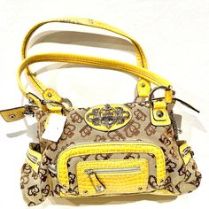 In New Conditions. For Some Reason One Of The Handles Came With A Mark On It. Check Last Picture. This Item Is A Kathy Van Zeeland Handbag In A Vibrant Yellow And Beige Color Combination. The Bag Features A Stylish Floral And Heart Pattern On The Beige Fabric, With Yellow Faux Crocodile Leather Accents On The Handles, Front Pocket, And Trim. The Bag Includes Silver-Tone Hardware, A Front Zippered Pocket, And A Central Kathy Van Zeeland Logo Plaque. The Interior Is Lined With A Bright Golden Yell Yellow Rectangular Bag With Branded Hardware, Yellow Travel Bag With Branded Hardware, Yellow Rectangular Bags With Branded Hardware, Yellow Handheld Bag, Yellow Shoulder Bag With Branded Hardware For Travel, Yellow Shoulder Bag With Branded Hardware, Yellow Crossbody Bag With Branded Hardware, Yellow Tote Satchel With Zipper Closure, Handheld Yellow Shoulder Bag With Removable Pouch