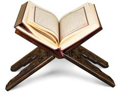 an open book sitting on top of a wooden stand