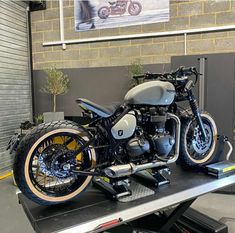 a motorcycle is parked on top of a trailer