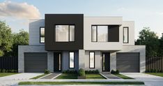 a two story house with black and white accents on the front, gray garage doors and windows