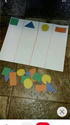 a piece of paper that has been cut out to look like shapes on the floor