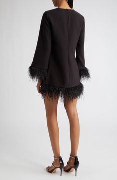 Feathered finishes bring the party to a long-sleeved dress ready to step out for the night. 29" length; 4" fringe (size 8) Jewel neck Long sleeves Lined, except sleeves 67% polyester, 27% rayon, 6% spandex Dry clean Imported Long Sleeve Mini Dress With Fringe For Party, Elegant Long-sleeved Dress With Tassels, Elegant Long Sleeve Dress With Tassels, Long Sleeve Dresses With Tassels For Night Out, Long Sleeve Fringe Dress For Fall, Long Sleeve Fringe Mini Dress For Night Out, Luxury Mini Dress For Fall Party, Fall Party Dresses With Tassels, Fall Cocktail Dress With Feather Trim