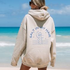 ✨ Step into comfort and style with my latest sweatshirt design! This hoodie is all about good summer vibes. A fun little expression to add a smile to your face. ✨ The design is laid-back and casual, perfect for those lazy days or casual outings. This unisex heavy blend hooded sweatshirt is cozy and comforting all in one. Made with a thick blend of fabrics, it feels plush and soft, a perfect choice. The front has a spacious pocket that adds convenience. Also includes a drawstring on the hood itself. ☀️ CARE INSTRUCTIONS☀️ ⚡️ Machine wash - warm (with like colors) ⚡️ Tumble dry - medium ⚡️ Do NOT dry clean ☀️ SIZING☀️ ⚡️ Unisex sizing ⚡️ Runs true to size ⚡️ Size up 2 sizes for oversized fit ☀️ FABRIC☀️ ⚡️ 50% cotton, 50% polyester ⚡️ Medium-heavy fabric Summer Vacation Cotton Hoodie, Cotton Hoodie For Summer Vacation, Vacation Hoodie With Relaxed Fit And Long Sleeves, Hooded Cotton Top For Vacation, Cotton Hooded Top For Vacation, Relaxed Fit Long Sleeve Hoodie For Vacation, Spring Vacation Long Sleeve Hoodie, Summer Casual Hoodie With Letter Print, Trendy Hooded Hoodie For Beach Season