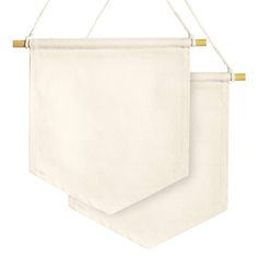 two white towels hanging on a rope against a white background with gold pins in the middle