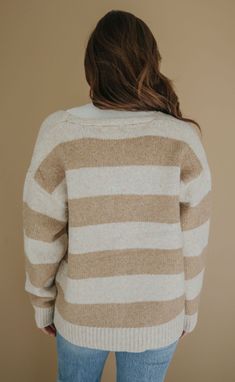 With neutral colored chunky stripes, this button front cardigan is the perfect addition to your wardrobe. Use it to layer on over a basic tee with denim during those crisp mornings and cool springtime days. Rosalind is 5'8" and is wearing size small size small measurements: 46" bust | 27" length 59% acrylic | 38% nylon | 3% wool PRODUCTS ON SALE ARE FINAL SALE! Feel free to email us at orders@shopriffraff.com or DM us with any questions regarding fit, styling, or our return policy in general. Cozy Beige V-neck Cardigan, Soft Knit V-neck Acrylic Cardigan, Cozy Multicolor V-neck Cardigan, Western Tee, Button Front Cardigan, Love Hat, Mink Pink, Gameday Outfit, Basic Tee