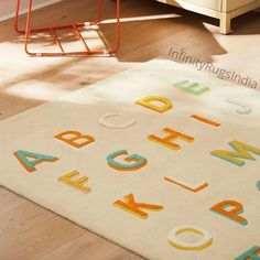 a child's rug with colorful letters on it