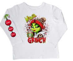 This Grinch Nana/Tata shirt brings the holiday spirit to your wardrobe! Its festive design and cozy fabric will have you feeling merry and bright all season long! Crafted from comfortable and durable material, this shirt will make a perfect addition to your holiday wardrobe. Let the Grinch bring cheer to your style this year! Winter Holiday Long Sleeve T-shirt, Festive Long Sleeve Top For Holidays, Festive Long Sleeve Tops For Holiday, Festive Long Sleeve Holiday Top, Long Sleeve Tops For Holiday Festivities, Christmas Festive Long Sleeve Tops, Festive Long Sleeve Tops For Christmas, Winter Festive Long Sleeve Tops, Green Long Sleeve Holiday Top