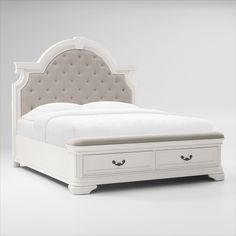 a white bed with drawers underneath it and a headboard on the bottom shelf,