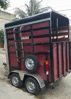 a small trailer that is parked on the street