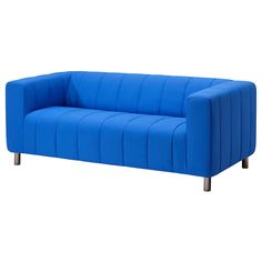 a blue couch sitting on top of a white floor